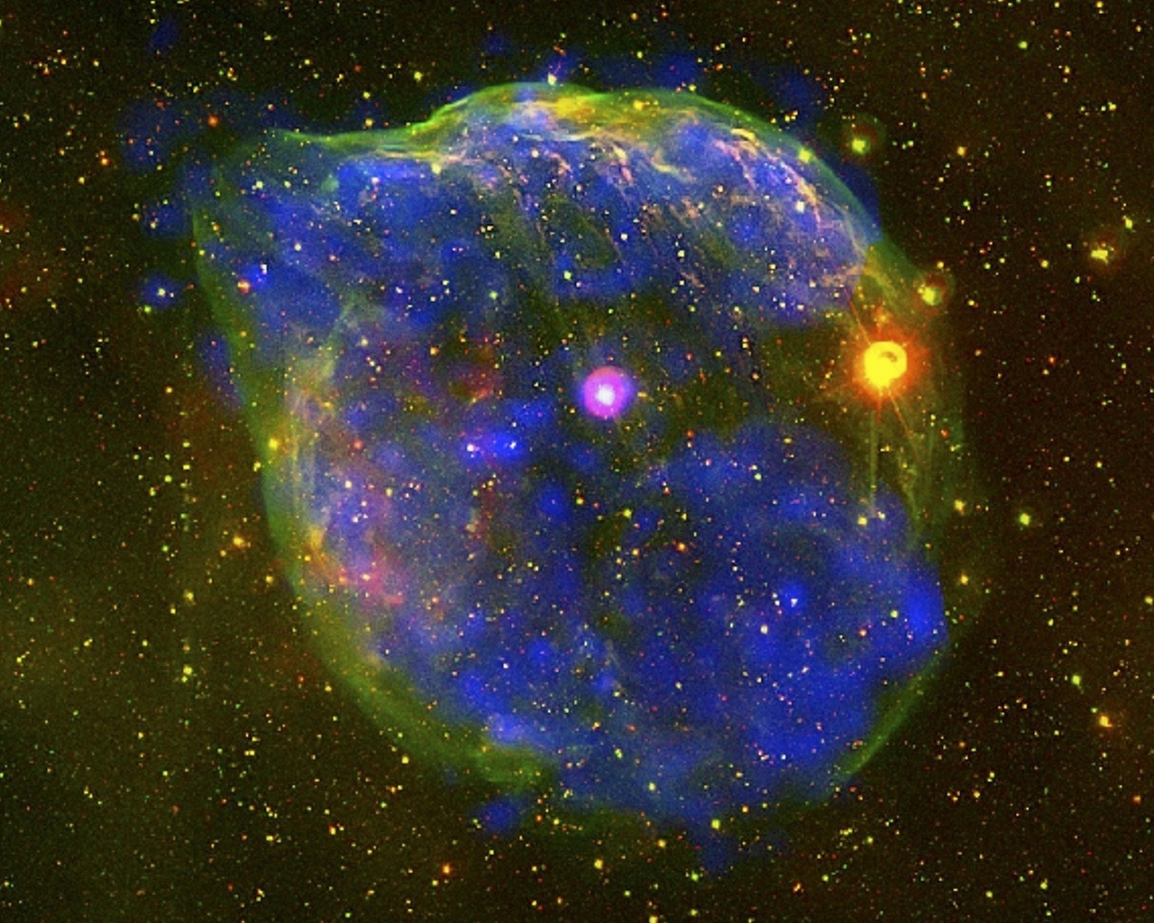 Звезда Вольфа-Райе (белая посередине, с фиолетовой аурой) и окружающая ее туманность